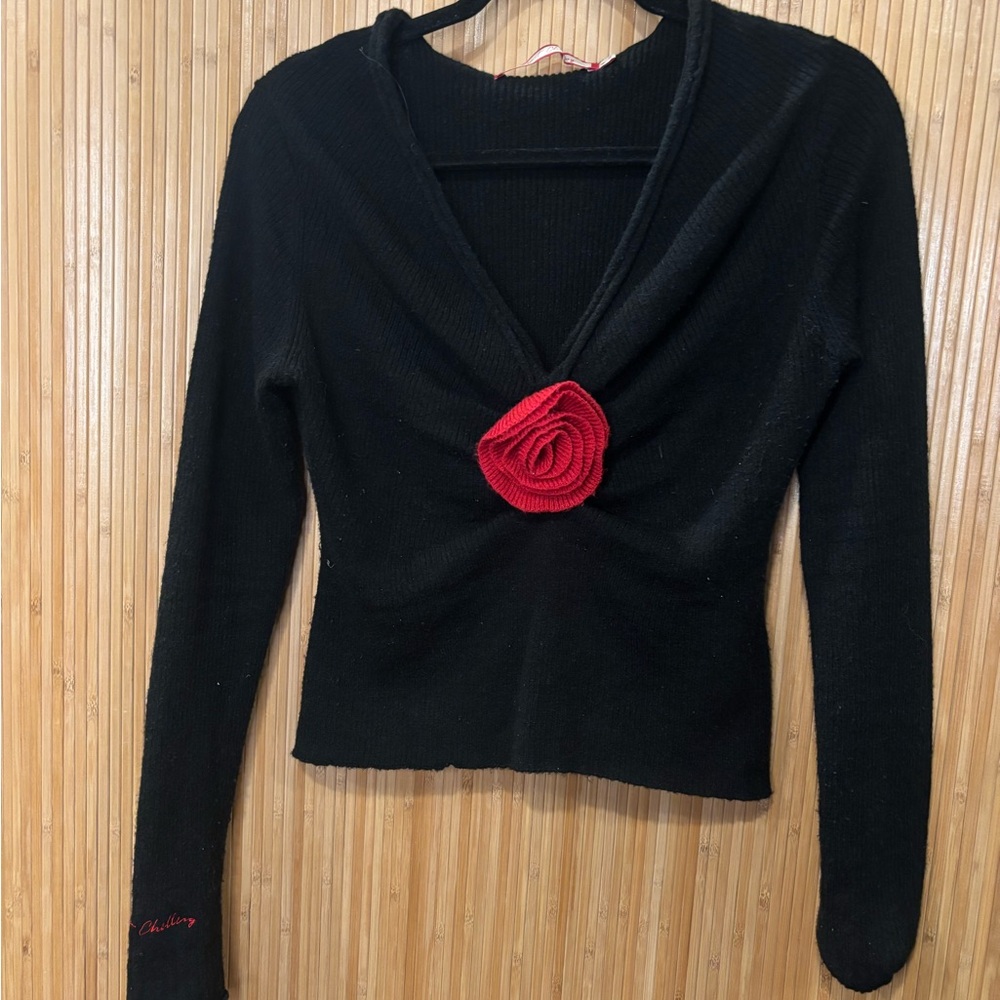 Chic Black Sweater with Red Rose Detail
